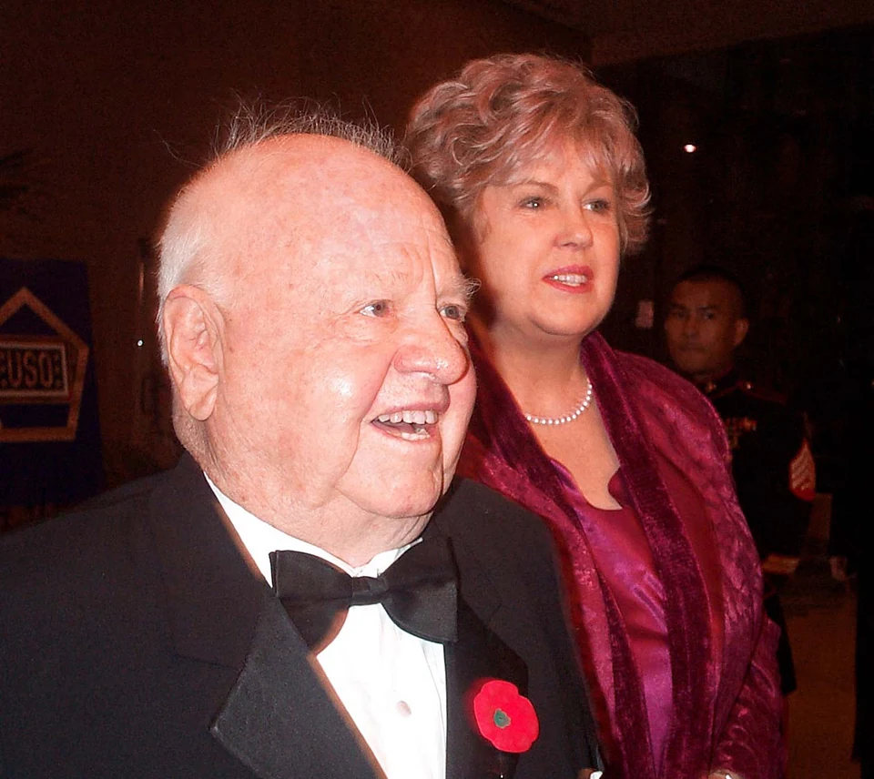 Mickey Rooney in a tuxedo with Jan Rooney at a military concert
